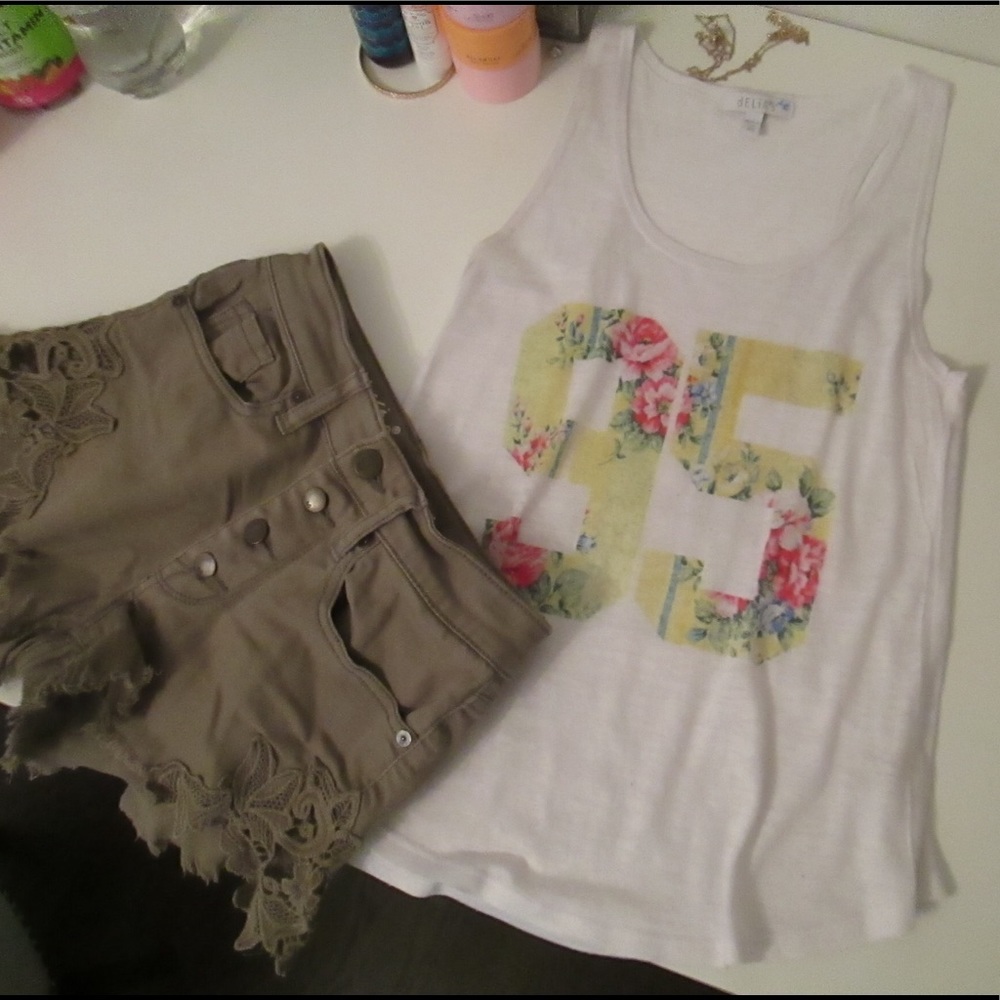 Delia’s white tank top with floral “95”